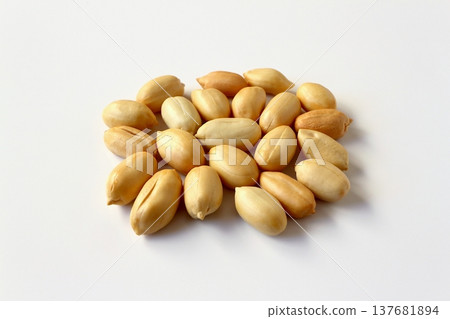 Lots of peanuts on a white background Lots of peanuts on a white background 137681894