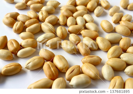 Lots of peanuts on a white background 137681895