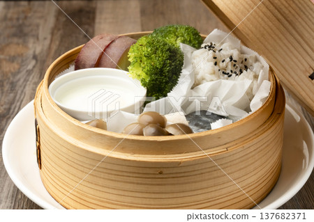 Steamed breakfast in a bamboo steamer Steamed breakfast in a bamboo steamer 137682371