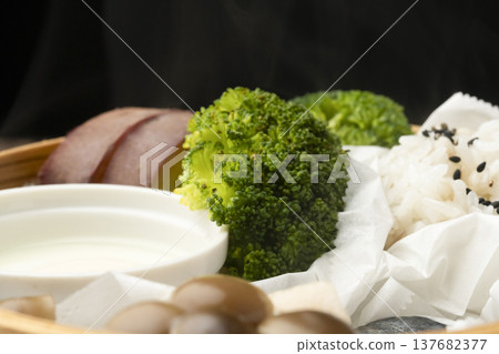 Steamed breakfast in a bamboo steamer Steamed breakfast in a bamboo steamer 137682377