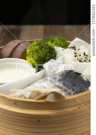 Steamed breakfast in a bamboo steamer Steamed breakfast in a bamboo steamer 137682383