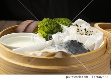 Steamed breakfast in a bamboo steamer Steamed breakfast in a bamboo steamer 137682385