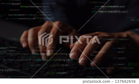 Close-up of Hands Typing on Keyboard with Overlay of Programming Code in Dark Environment for Technology and Software Development Concept xenic Close-up of Hands Typing on Keyboard with Overlay of Programming Code in Dark Environment for Technology and Software Development Concept xenic 137682656