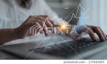 Professional individual analyzing financial data on laptop with overlay of digital graph showing market trends and statistics for investment analysis Scalp Professional individual analyzing financial data on laptop with overlay of digital graph showing market trends and statistics for investment analysis Scalp 137682665
