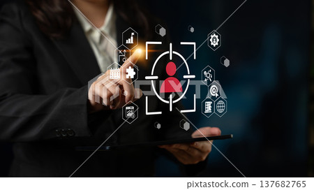 Business professional interacting with digital interface, using tablet to access data and analytics for user identification and management strategy Gantry 137682765