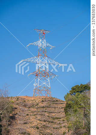 A power transmission tower standing on a mountaintop in Omi-Shiotsu, Nagahama City, Shiga Prefecture A power transmission tower standing on a mountaintop in Omi-Shiotsu, Nagahama City, Shiga Prefecture 137683030