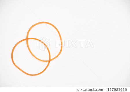 Simple product photography with a white background and rubber bands. 137683626