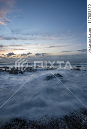 Sunrise over the turbulent torii gate at Kamiiso 137685850