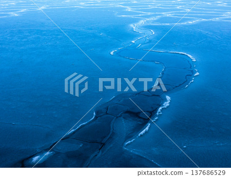 The frozen landscape of Yubetsu Fishing Port in the Okhotsk region of Hokkaido in the middle of winter. The frozen landscape of Yubetsu Fishing Port in the Okhotsk region of Hokkaido in the middle of winter. 137686529