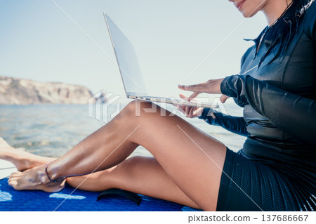 Woman Laptop Beach Working Remotely on Boat Woman Laptop Beach Working Remotely on Boat 137686667