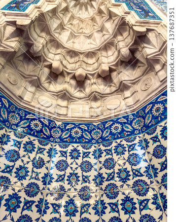 Intricate geometric ceiling design with colorful tile work featuring floral patterns in a historic architectural setting Intricate geometric ceiling design with colorful tile work featuring floral patterns in a historic architectural setting 137687351