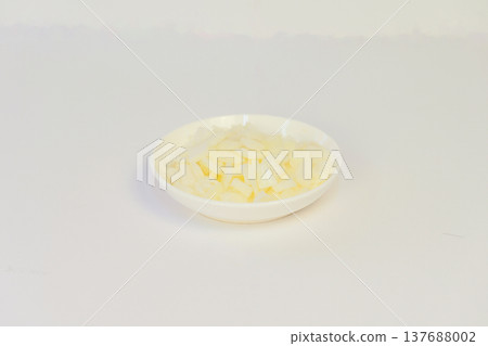 Sliced new onions on a white background Sliced new onions on a white background 137688002