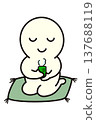 A simple figure sitting on a cushion and drinking tea. 137688119