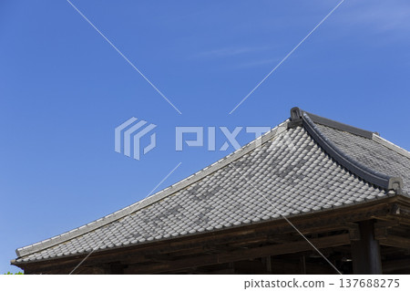 Tiled roofs stand out against the blue sky 137688275