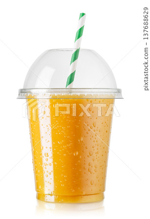 Freshly squeezed cold orange juice in disposable plastic cup with domed lid and straw isolated on white Freshly squeezed cold orange juice in disposable plastic cup with domed lid and straw isolated on white 137688629