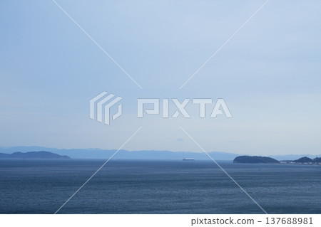 A view of the Kitan Strait and Tomogashima Island in the distance from Sumoto Onsen in Hyogo Prefecture [March] 137688981