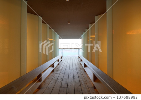 The sea and sky as seen from the end of the corridor on the top floor of the hotel [March] 137688982