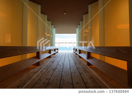 The sea and sky as seen from the end of the corridor on the top floor of the hotel [March] 137688984