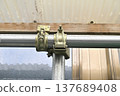 Fixing structure of the joint between the single pipe and the rafter clamp (front view, close-up) 137689408