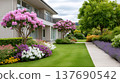Modern house exterior with lush flowering garden landscaping 137690542