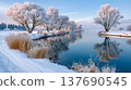 Winter landscape with snow-covered trees reflecting in river 137690545