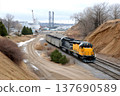 Diesel freight train moving along industrial railway tracks 137690589
