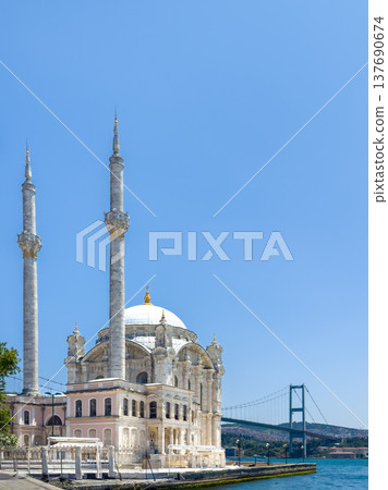 Ortakoy Mosque with the Bosphorus Bridge and bright blue sky in the background on a sunny summer day Ortakoy Mosque with the Bosphorus Bridge and bright blue sky in the background on a sunny summer day 137690674