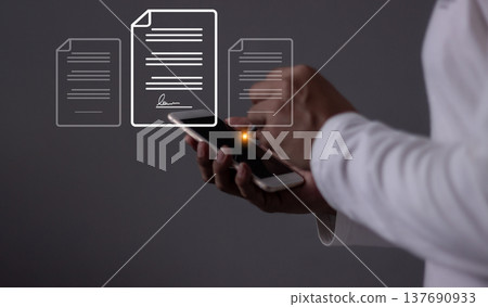 Young man with smartphone mobile hand using a pen touching to sign a Online Business Contract, Electronic signature, Contract signing, Digital documents, Future smart contract Young man with smartphone mobile hand using a pen touching to sign a Online Business Contract, Electronic signature, Contract signing, Digital documents, Future smart contract 137690933