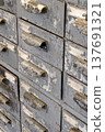 Very old grey metal cabinet with multiple drawers - cards, files, tools or fasteners storage unit 137691321