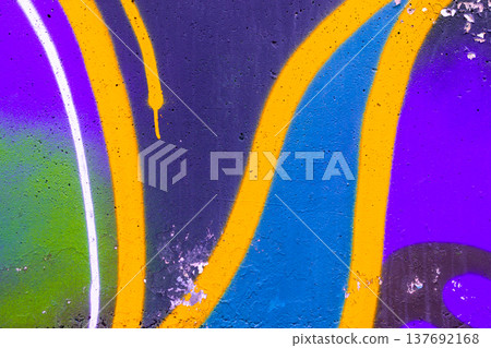 Vibrant graffiti wall with abstract shapes in purple, blue, yellow, urban art context 137692168