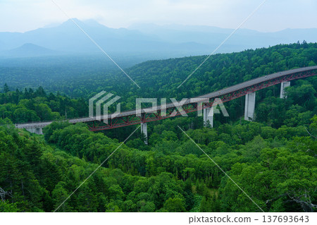 Hokkaido, Mikuni Pass, Matsumi Bridge and the scenery of the primeval forest of Daisetsuzan Mountains. Hokkaido, Mikuni Pass, Matsumi Bridge and the scenery of the primeval forest of Daisetsuzan Mountains. 137693643
