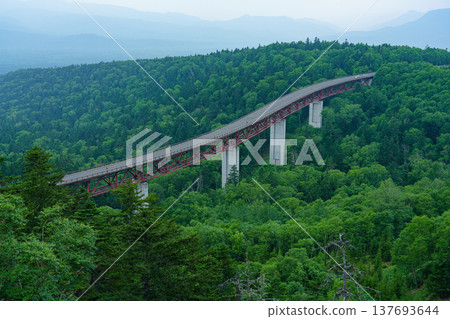 Hokkaido, Mikuni Pass, Matsumi Bridge and the scenery of the primeval forest of Daisetsuzan Mountains. Hokkaido, Mikuni Pass, Matsumi Bridge and the scenery of the primeval forest of Daisetsuzan Mountains. 137693644