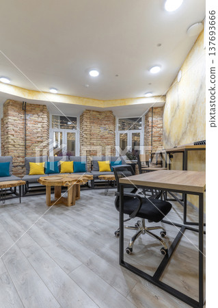 Hostel Common Area with Coworking Desk and Industrial Lounge 137693666