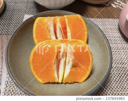 Mandarin oranges on a plate for dinner 137693965