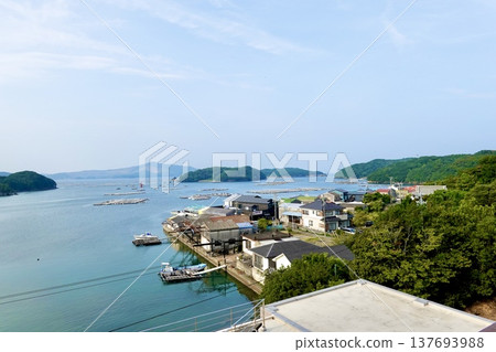 A scene of oyster farming rafts floating on Ikuura Bay in Honura Onsen, Ise-Shima, Toba City, Mie Prefecture. A scene of oyster farming rafts floating on Ikuura Bay in Honura Onsen, Ise-Shima, Toba City, Mie Prefecture. 137693988