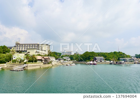 A view of the quay at Kashikojima Port from a cruise ship in Ago Bay, Ise-Shima, Shima City, Mie Prefecture. A view of the quay at Kashikojima Port from a cruise ship in Ago Bay, Ise-Shima, Shima City, Mie Prefecture. 137694004