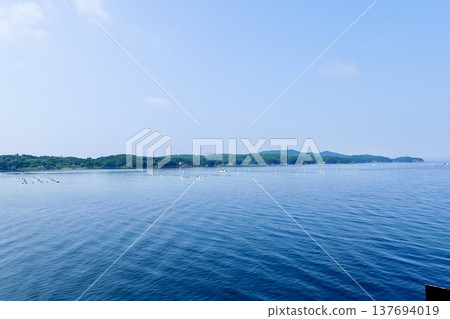 Ise-Shima: A view of the calm sea and islands from a cruise ship in Ago Bay, Shima City, Mie Prefecture. Ise-Shima: A view of the calm sea and islands from a cruise ship in Ago Bay, Shima City, Mie Prefecture. 137694019