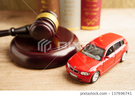 Bangkok, Thailand March 15, 2023 Car accident lawsuit and insurance, Judge hammer with car model. 137696741