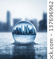 Modern Cityscape Reflected in a Glass Sphere on an Icy Surface 137696962
