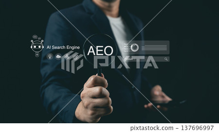 Businessman holding magnifying glass with AEO text and AI search engine futuristic digital overlay for digital marketing strategy on dark background Businessman holding magnifying glass with AEO text and AI search engine futuristic digital overlay for digital marketing strategy on dark background 137696997