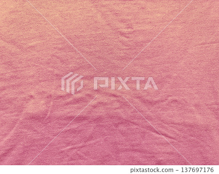 soft pink ribbed fabric texture unfolds in gentle wrinkles with gradient fade and ample copy space for minimalist wallpaper or commercial banner background soft pink ribbed fabric texture unfolds in gentle wrinkles with gradient fade and ample copy space for minimalist wallpaper or commercial banner background 137697176