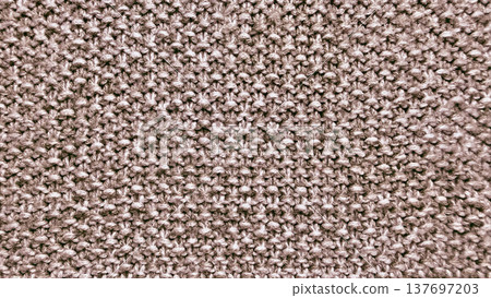intricate beige knitted wool texture closeup capturing cozy warmth and detailed stitches perfect for rustic wallpaper or textile design background intricate beige knitted wool texture closeup capturing cozy warmth and detailed stitches perfect for rustic wallpaper or textile design background 137697203