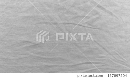 soft light gray knit fabric texture closeup with gentle wrinkles and ribbed weave evoking calm minimalism perfect for subtle wallpaper or copy space banner in web design 137697204