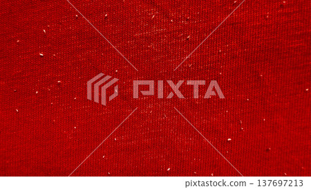 close up crimson knitted fabric texture speckled with subtle white fibers evoking cozy warmth for winter wallpaper or festive banner background 137697213