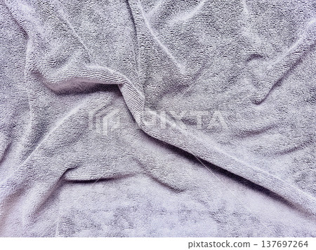 folded gray terrycloth towel texture for spa branding and web background folded gray terrycloth towel texture for spa branding and web background 137697264