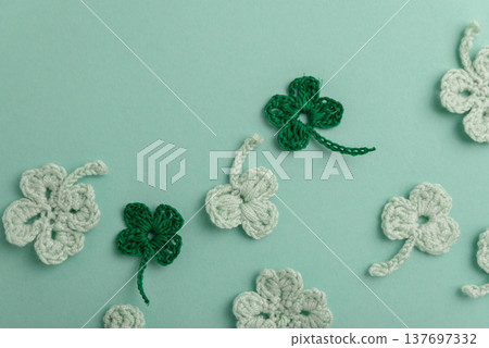 Crocheted Four Leaf Clovers with Sequins.  Saint Patricks Day Decorative Background 137697332