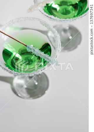 Green Martini Cocktails with Rock Candy. Festive St. Patricks Day Celebration Still Life Green Martini Cocktails with Rock Candy. Festive St. Patricks Day Celebration Still Life 137697341