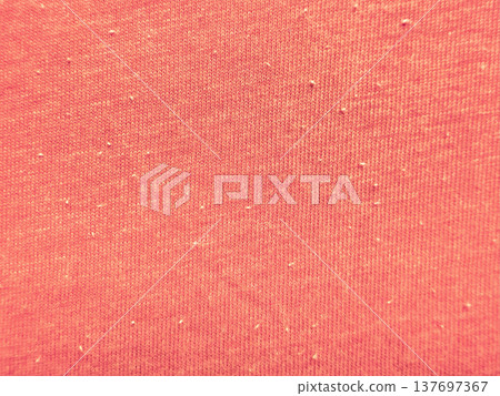 vibrant coral orange knit fabric texture close-up with subtle white lint specks and woven pattern details for web design background, print media pattern, or branding element in soft warm tones vibrant coral orange knit fabric texture close-up with subtle white lint specks and woven pattern details for web design background, print media pattern, or branding element in soft warm tones 137697367