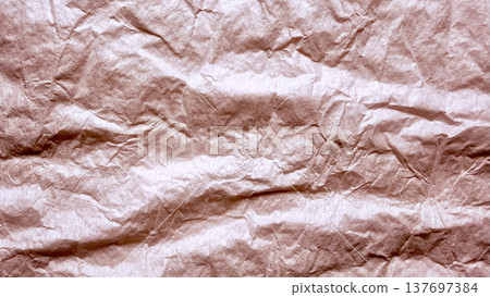 crumpled brown kraft paper texture with wrinkles and creases for vintage background design or rustic branding graphic 137697384