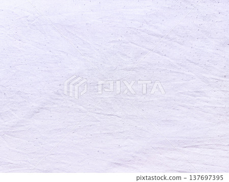 closeup wrinkled pale lavender fabric texture with subtle speckles and soft folds for seamless background or design wallpaper 137697395